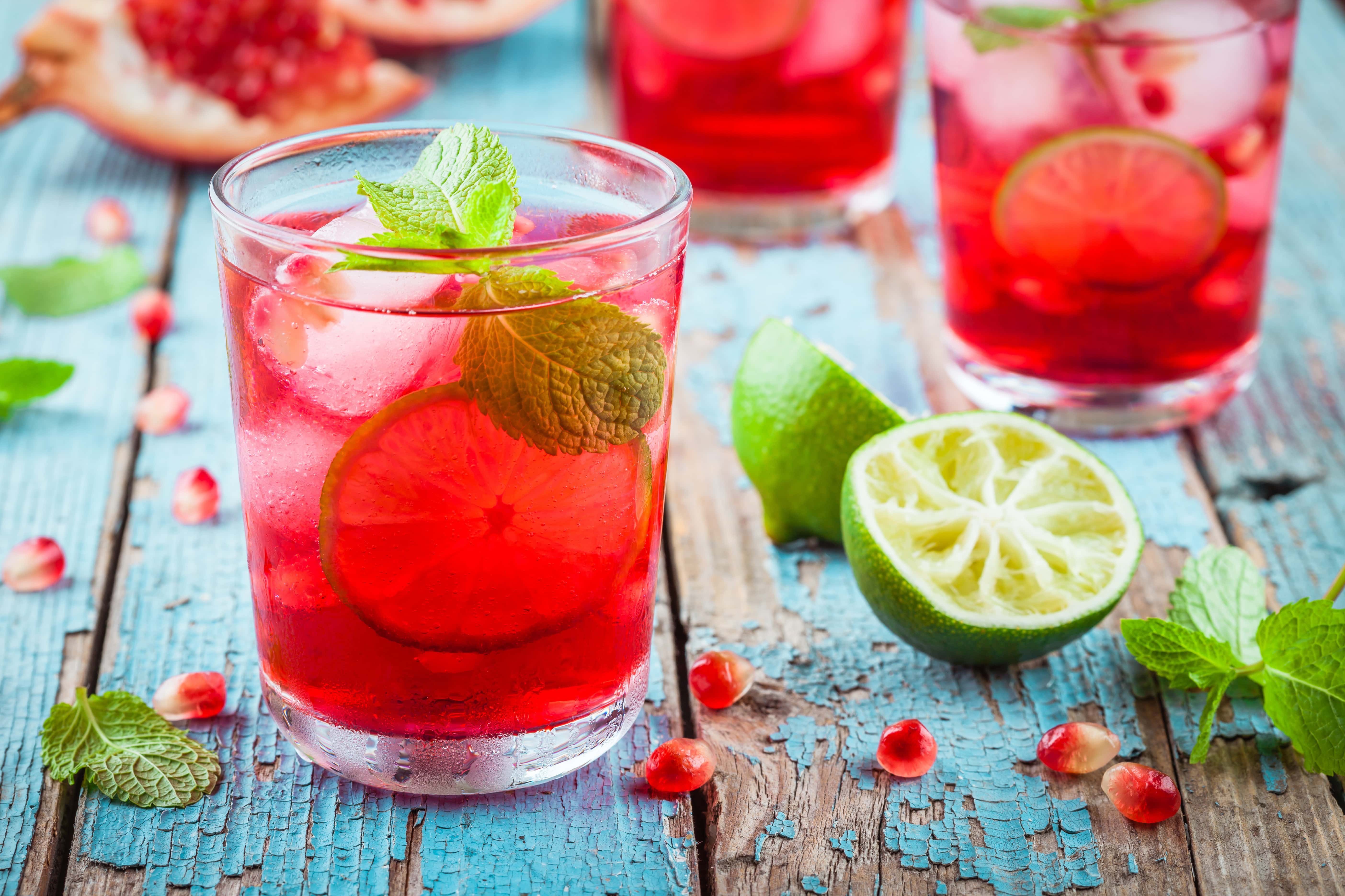 cold homemade lemonade with pomegranate, mint and lime