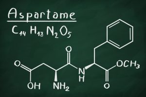 Chemical formula of Aspartame on a blackboard