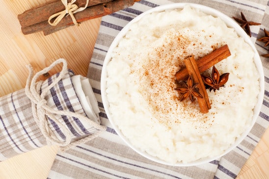 Delicious rice pudding with cinnamon and star anise. Luxurious sweet dessert concept.