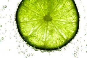 lime slice in water bubbles